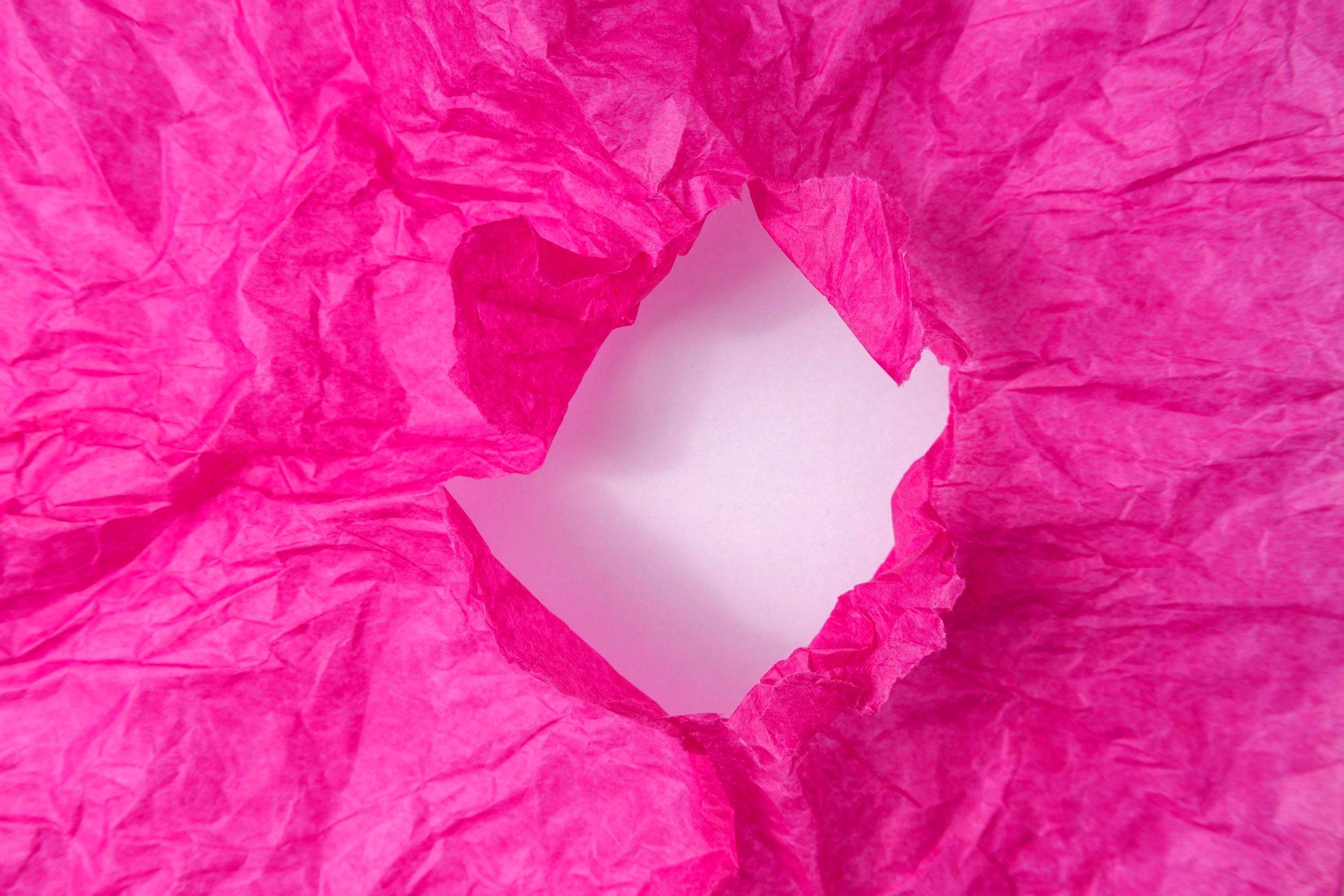 Crumpled pink tissue paper texture