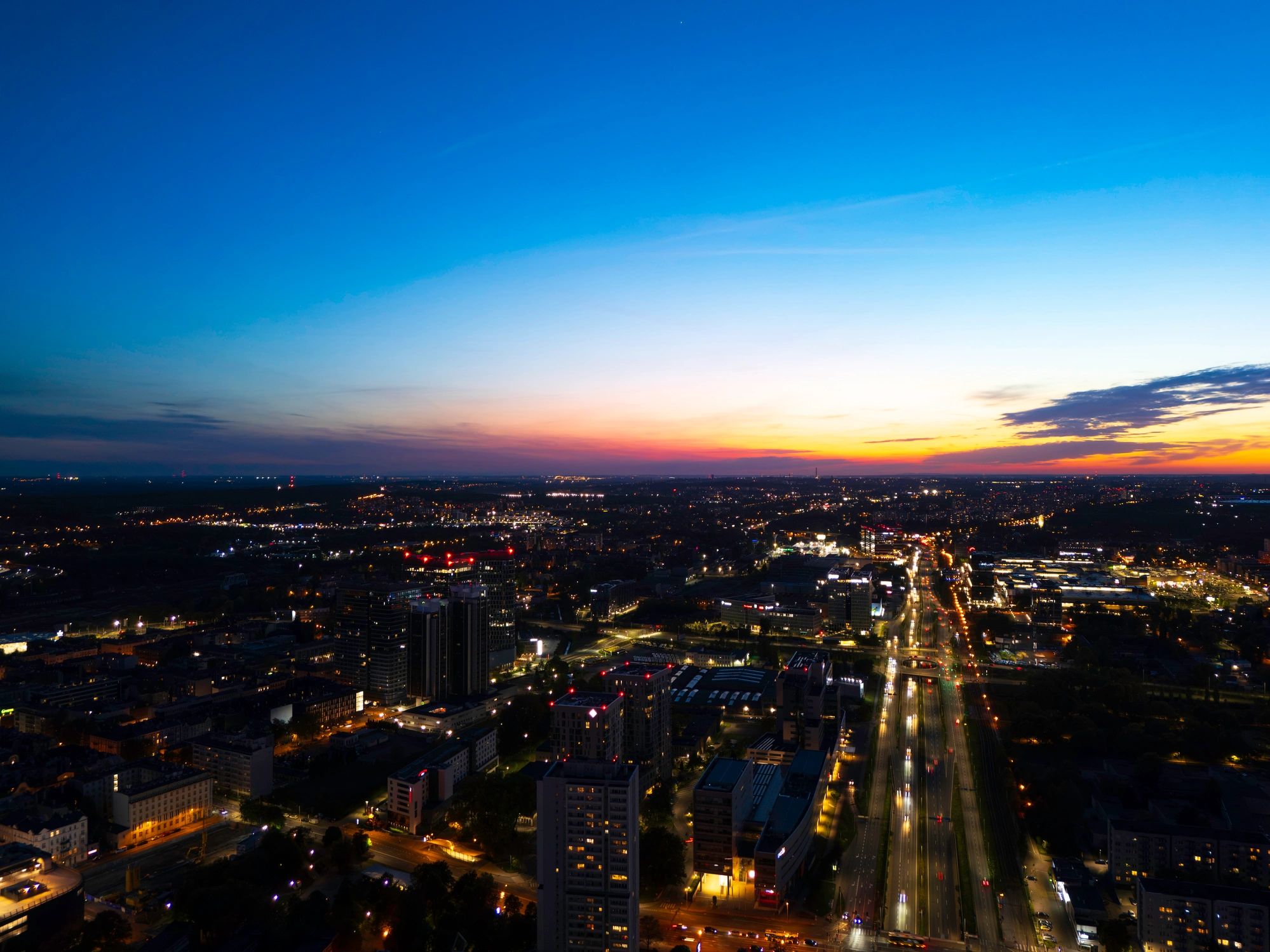 Panoramic evening urban scene with illuminated structures