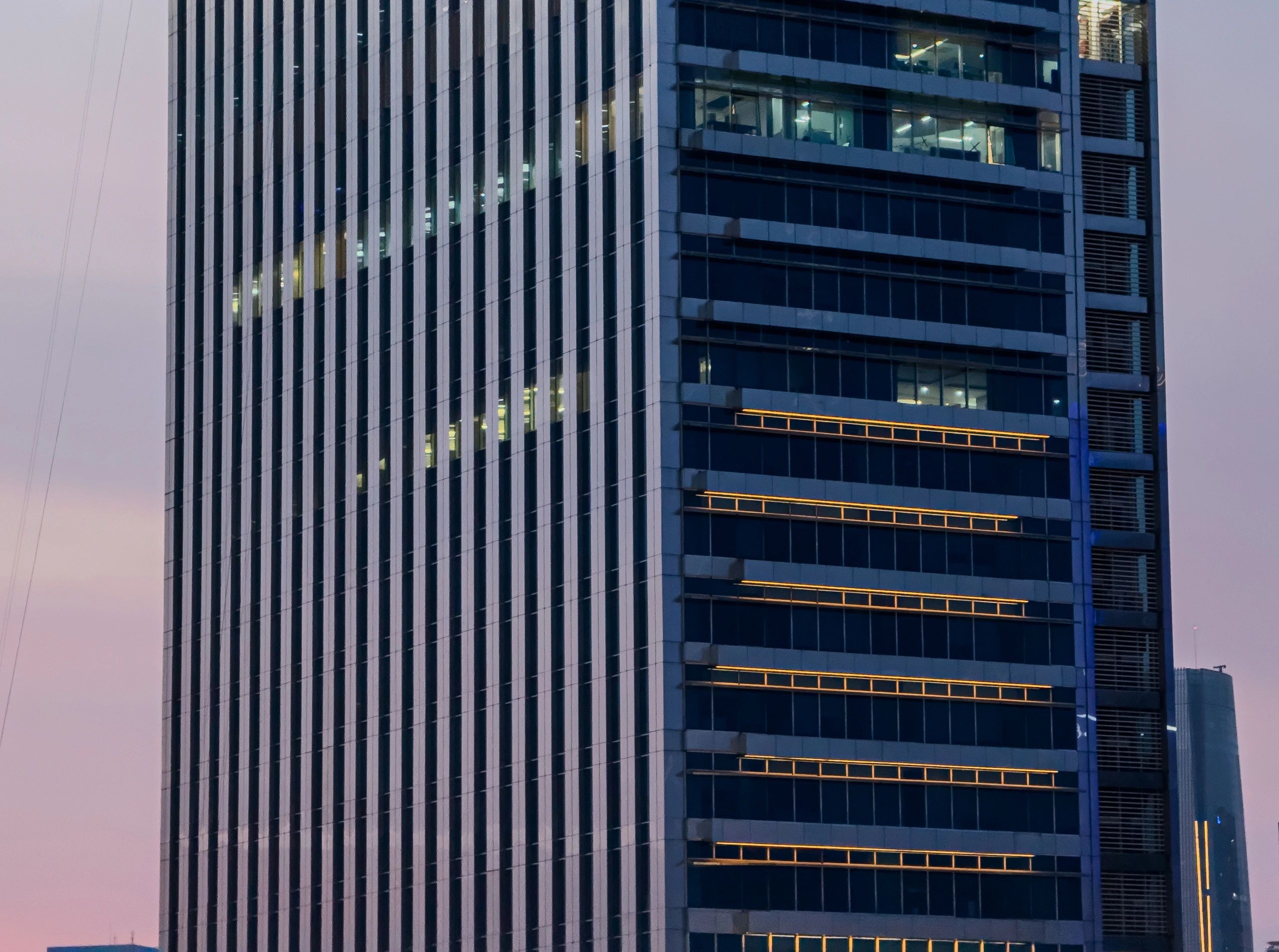 City skyline at sunset with pink and blue sky