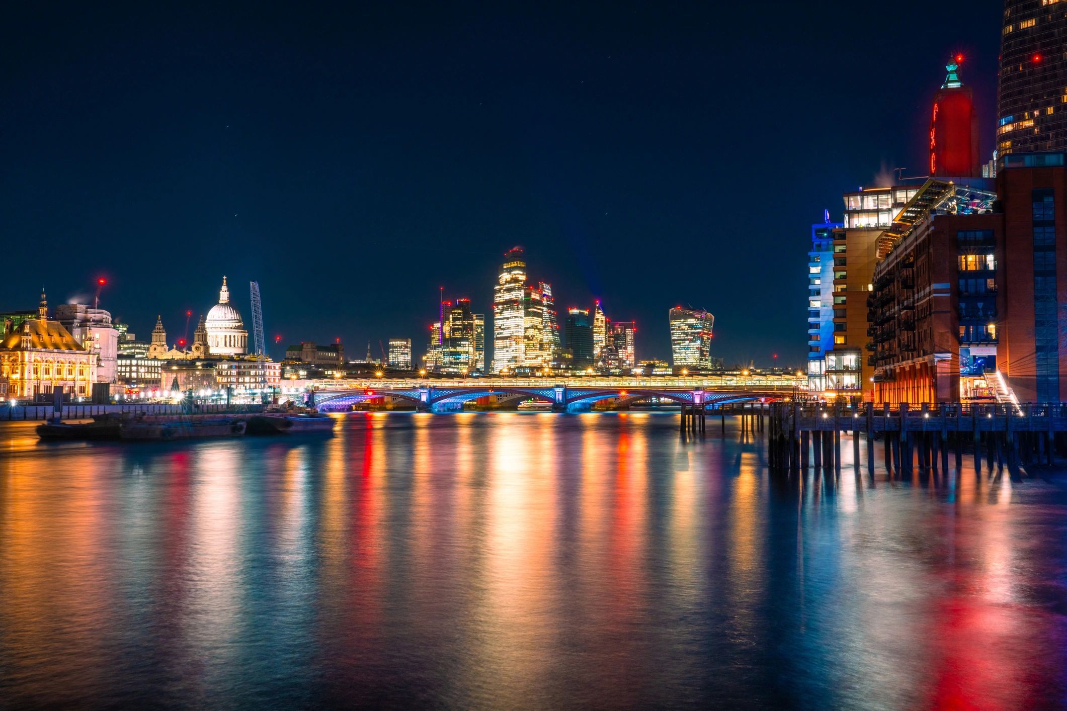 London city lights reflecting on the River Thames at night