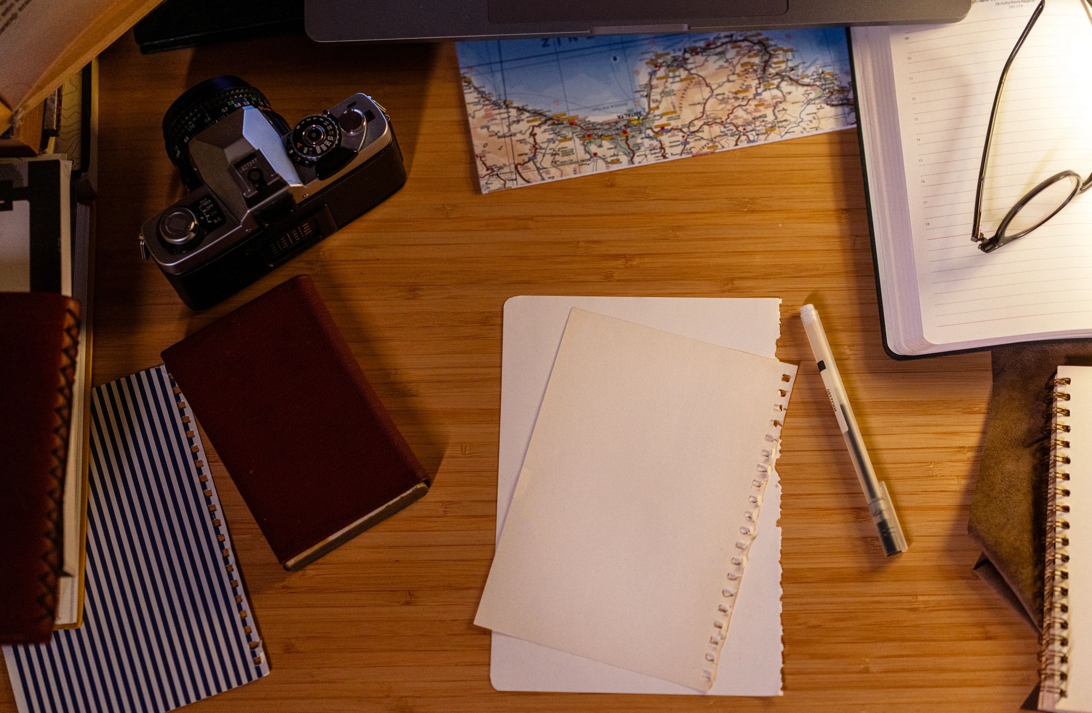 Creative workspace with a map and camera