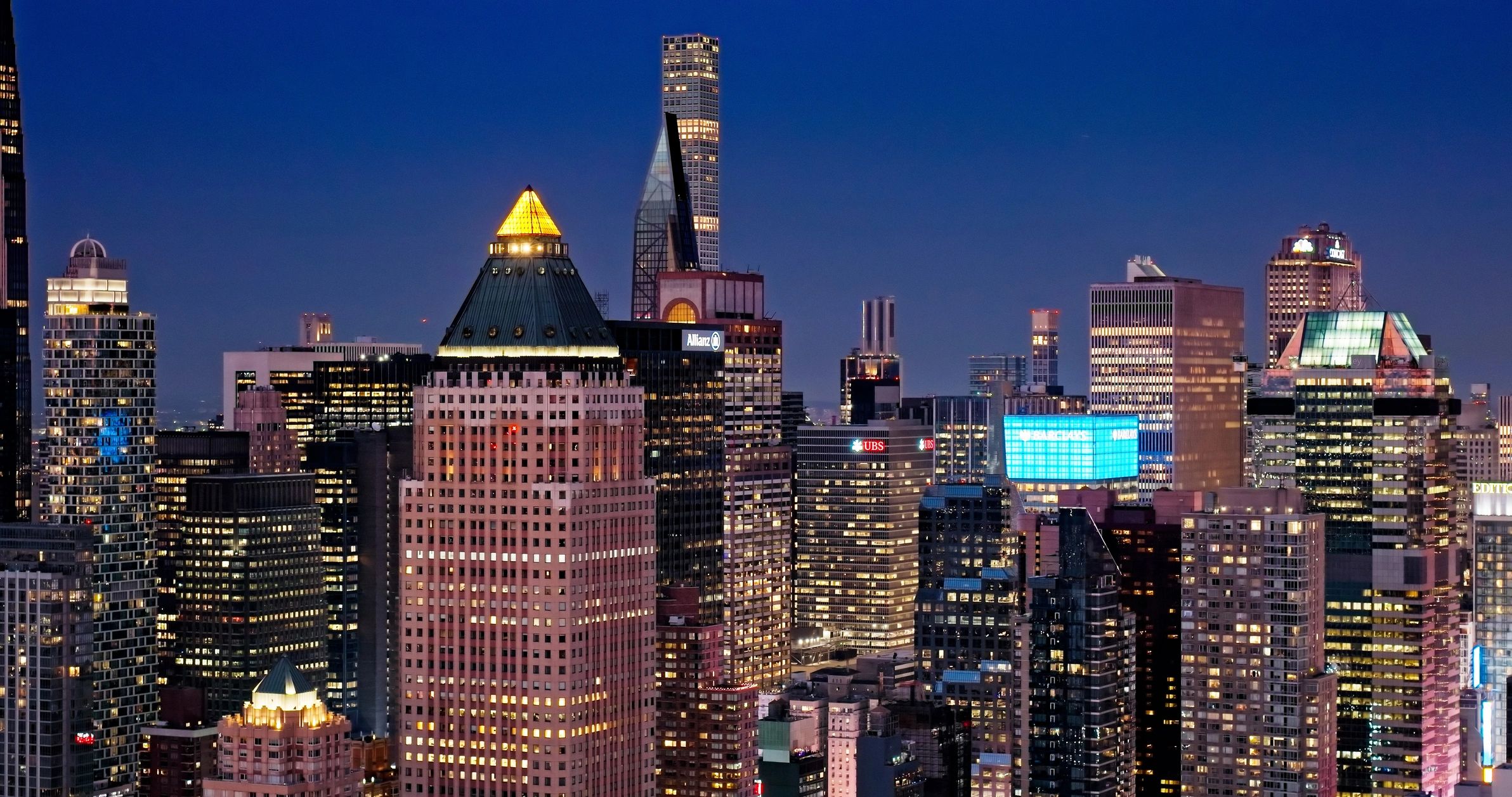 Aerial view of dense city skyscrapers at dusk
